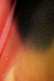 Abstract play of soft gradients and muted gold accents blending into deep black, suggesting luxury and depth.