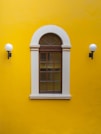 a window in a yellow building