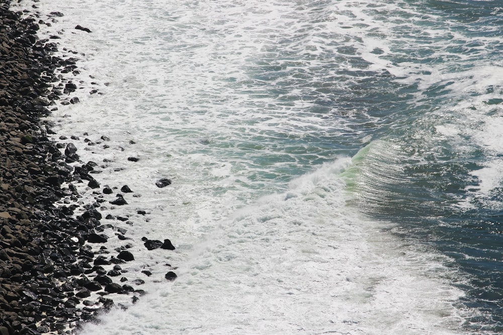 a rocky beach with waves crashing