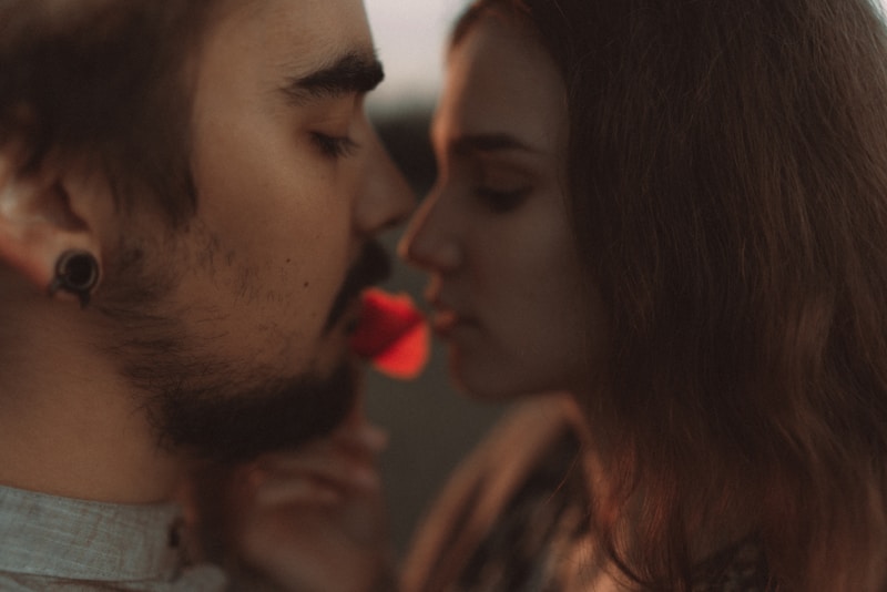 a man and woman kissing