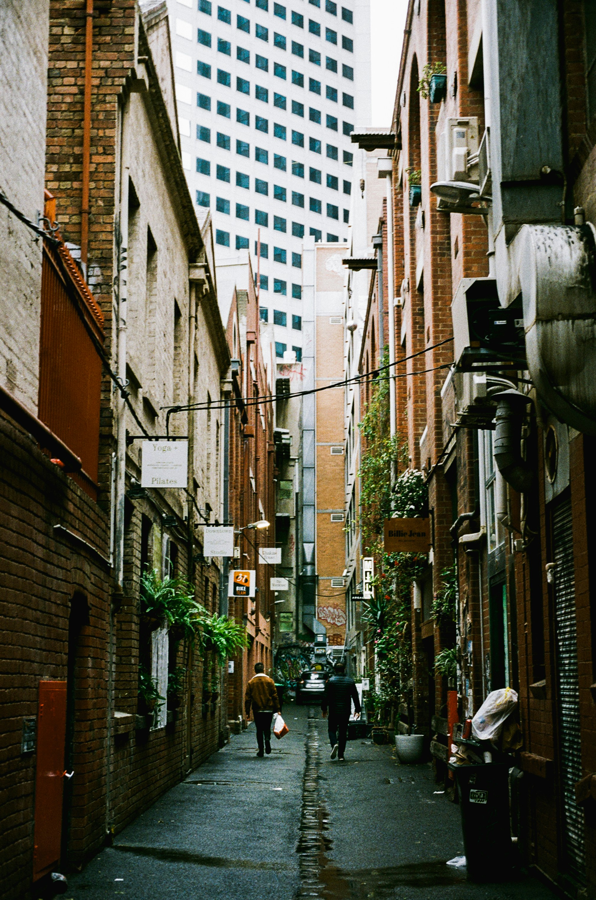 people walking down a street