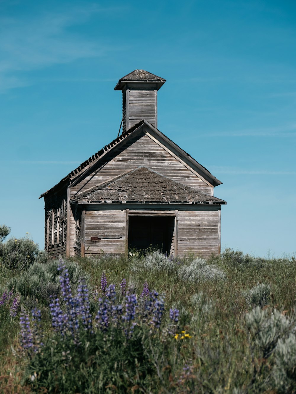 a wood building with a tower