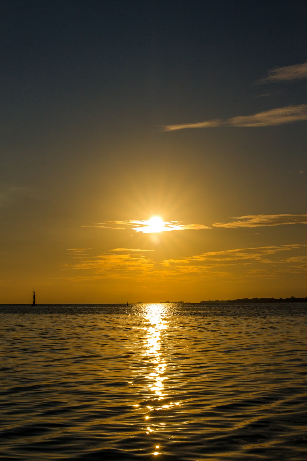 a body of water with a sunset