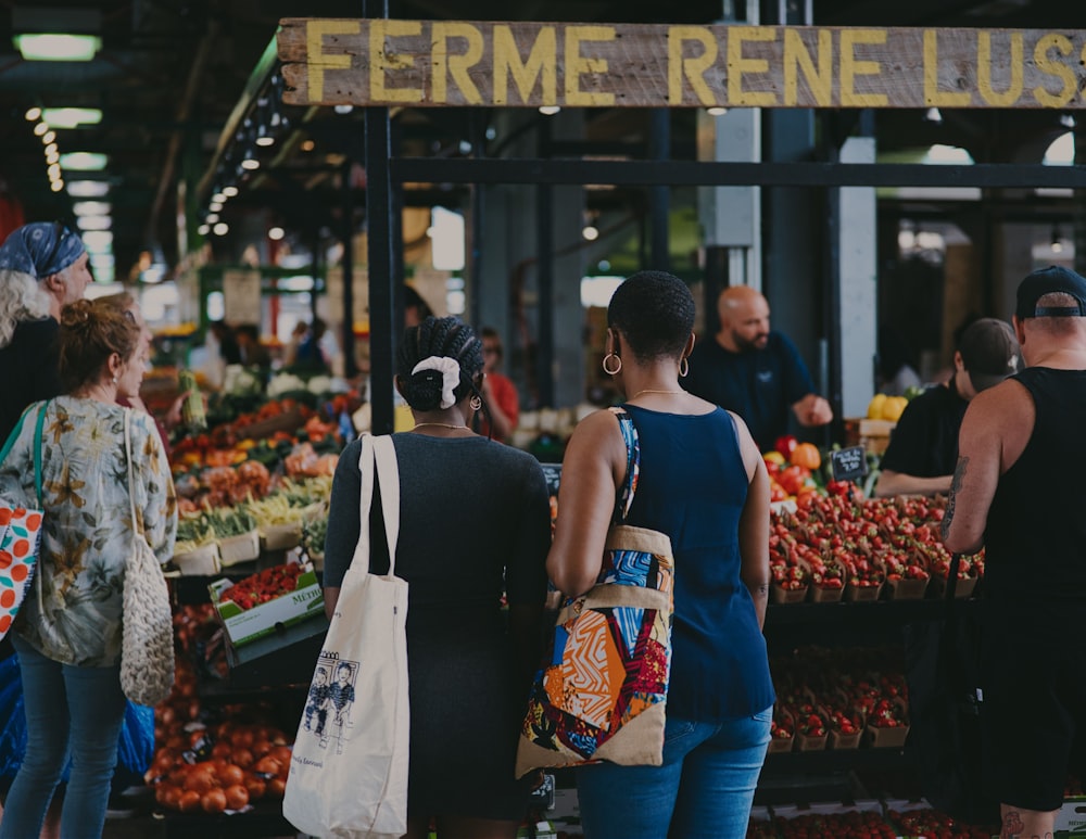 a group of people at a farmers market