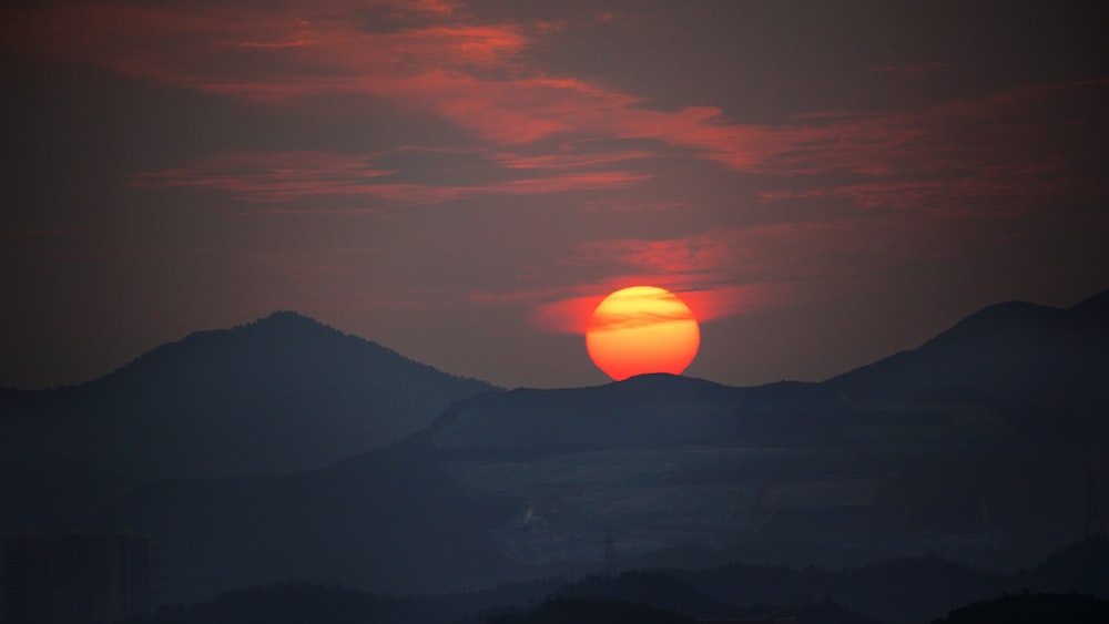 a sunset over a mountain range