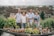 A family smiling together at a beautiful destination arranged by Bemacy.