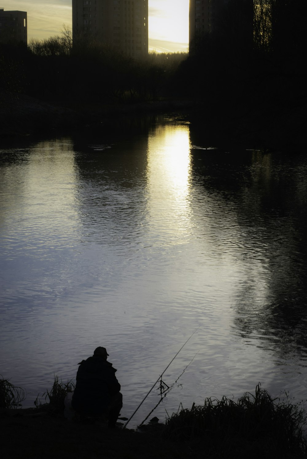 a person fishing in a river