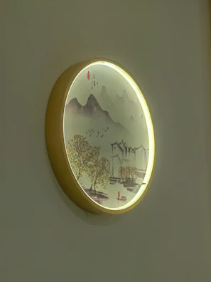 A serene landscape painting showcased with subtle spotlighting in the vault.