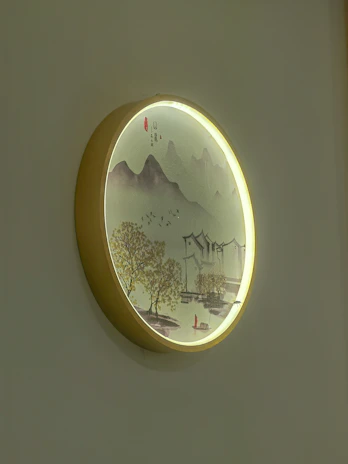 Wooden wall art piece with a layered laser-cut mountain landscape in warm tones.