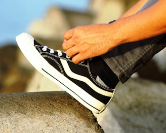 a person tying a shoe