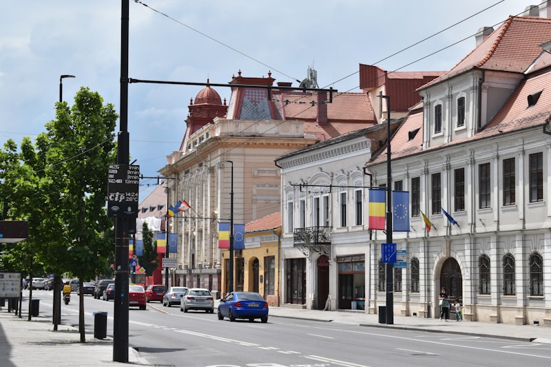 a street with cars and buildings along it