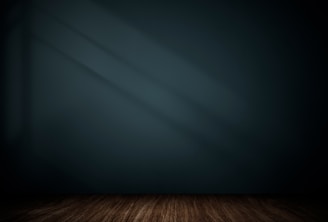 A cozy therapy room bathed in soft tanish blue-green light, inviting calm and trust.