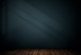 Spacious, light-filled room with teal accents and subtle gold highlights.