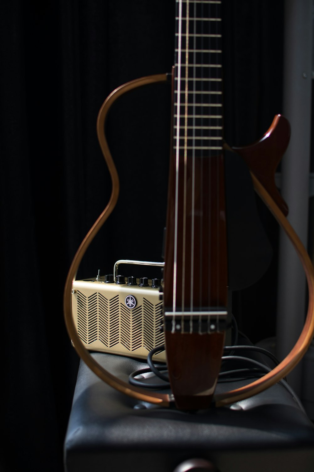 a guitar leaning against a wall