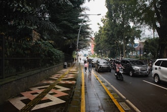 a street with cars and people on it