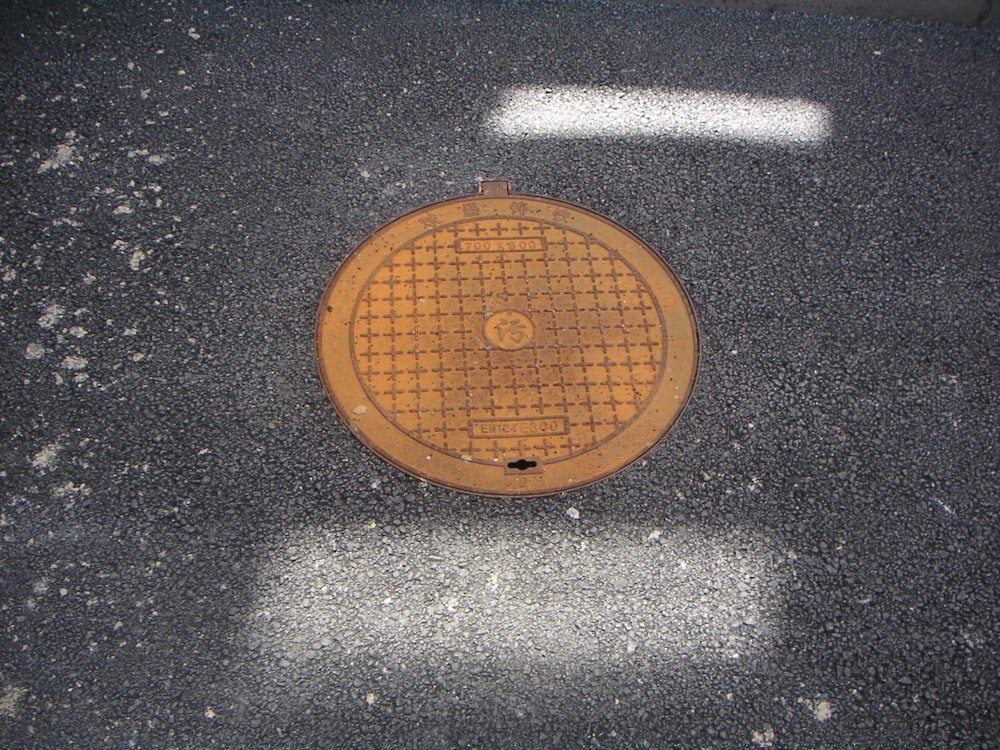 a brown guitar on a black surface