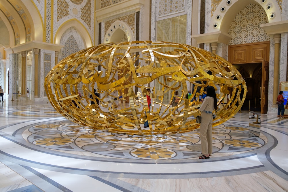 a large gold sculpture in a building