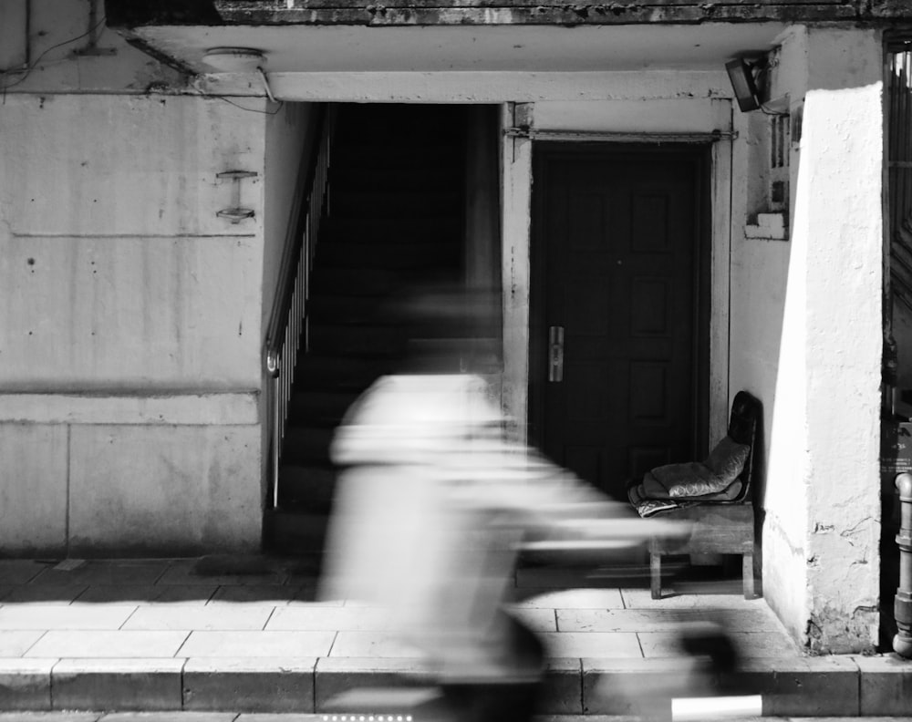 a person sitting in a doorway