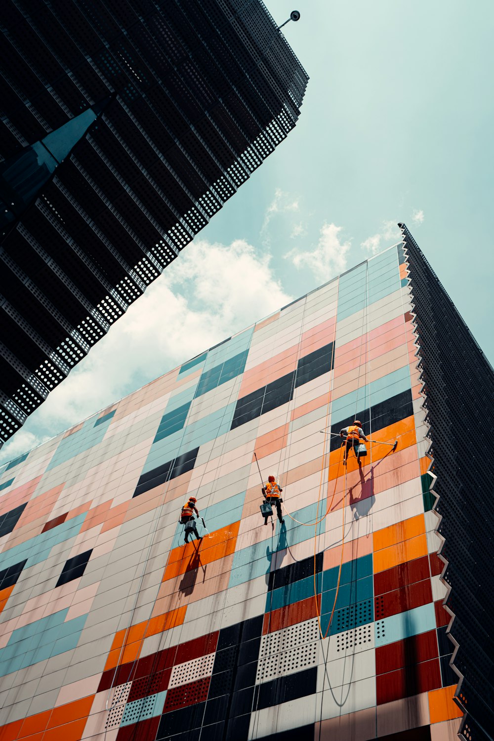 a group of people climbing a building