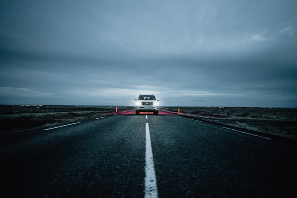 a truck driving down a road