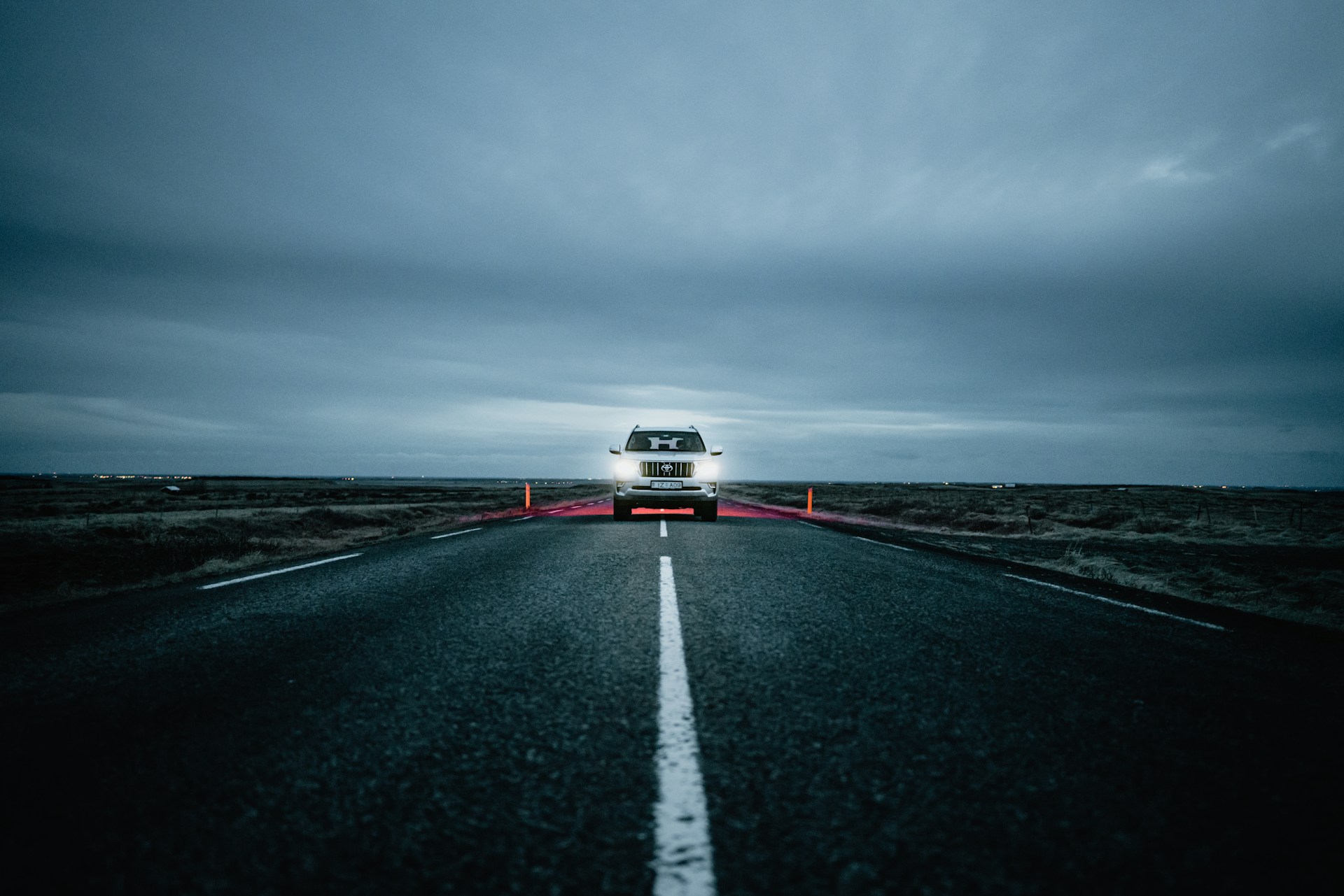 a truck driving down a road