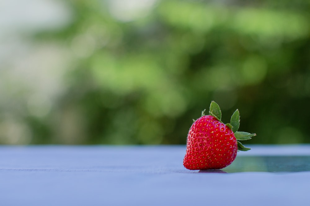 a strawberry on a table