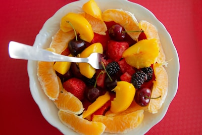 a bowl of fruit on a plate