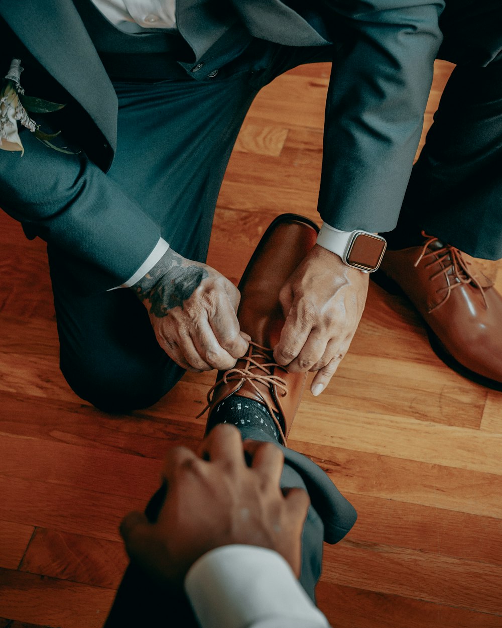 a group of people tying their shoes