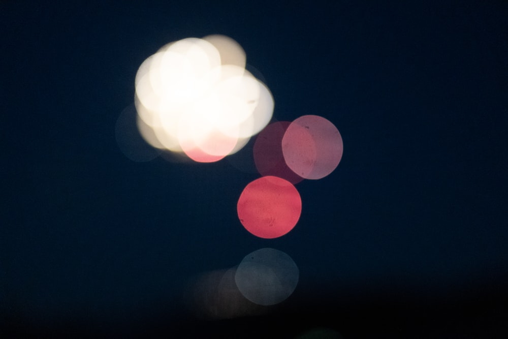 a group of red and white balloons