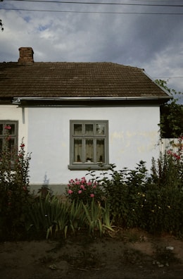 Exterior shot of a small home with recent electrical upgrades visible.
