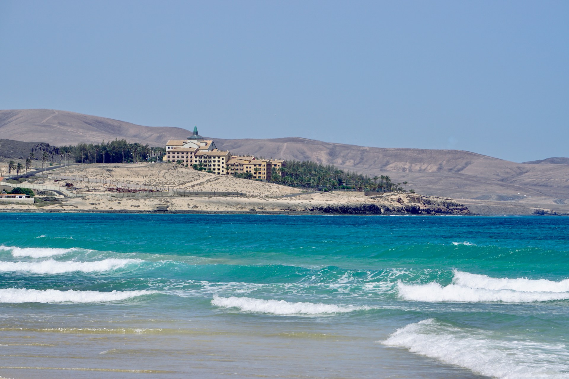 a beach with a building on it