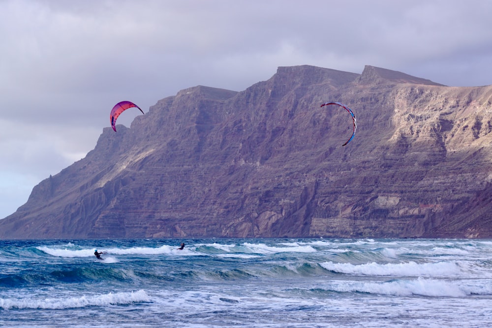 people kite surfing in the sea