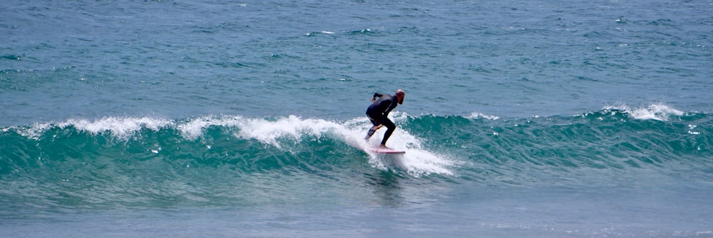 a man riding a surfboard