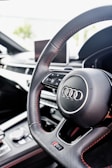 the steering wheel and dashboard of a car