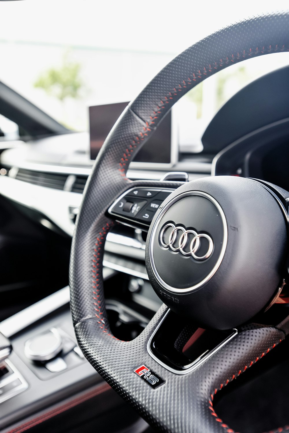 the steering wheel and dashboard of a car