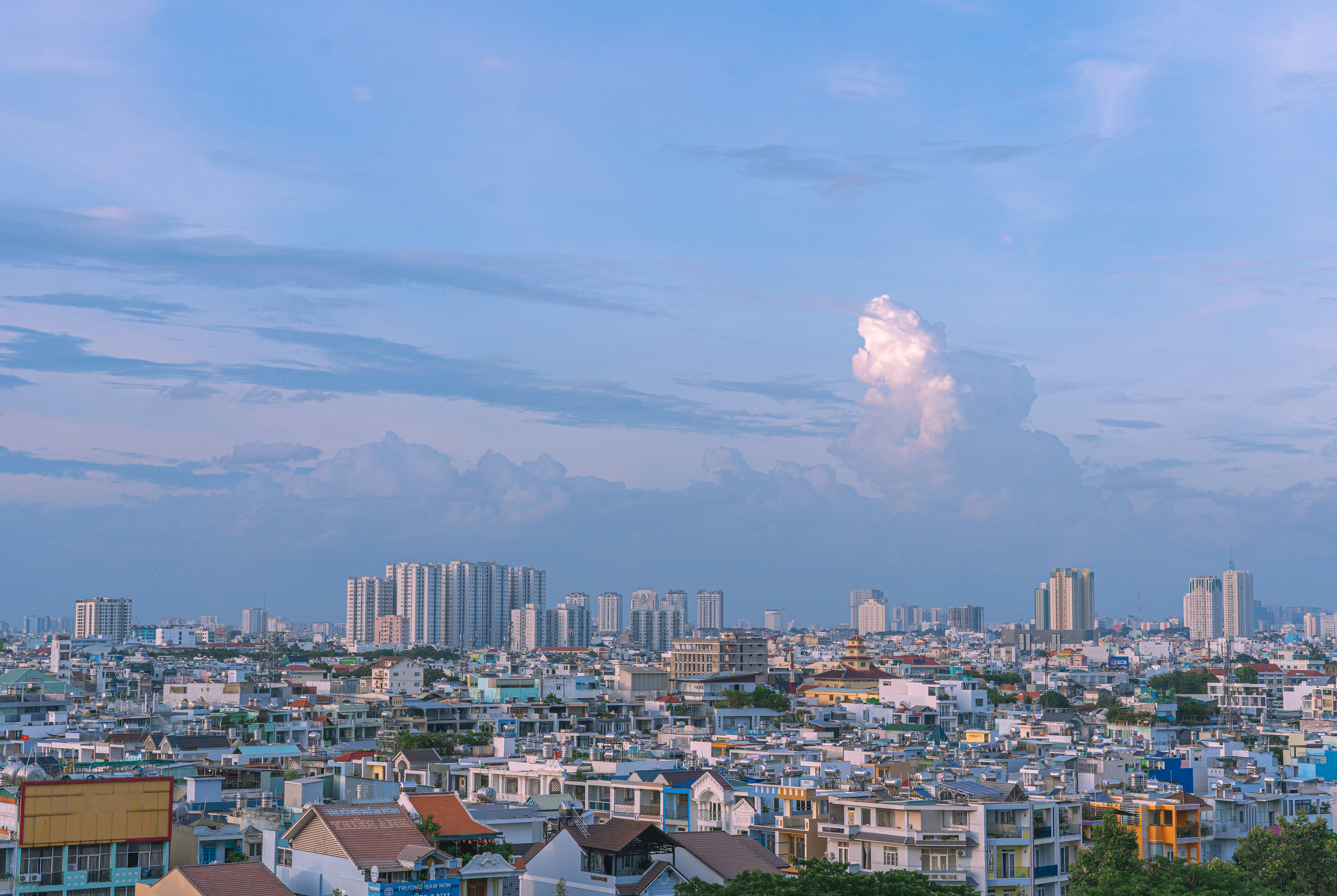 a city with a cloud in the sky