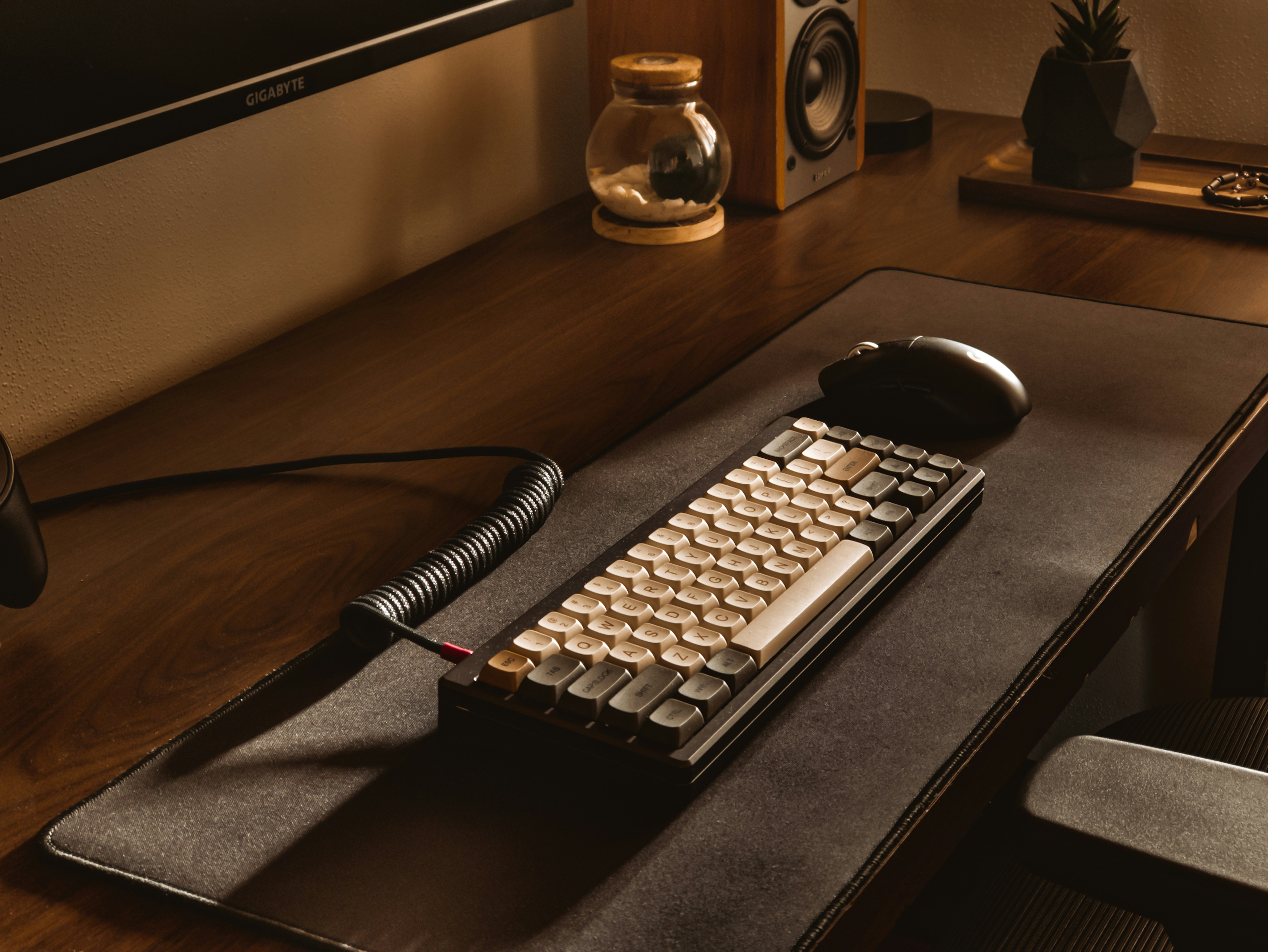 a keyboard and mouse on a desk
