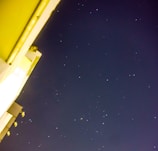 Iconic landmark glowing under a clear night sky filled with stars