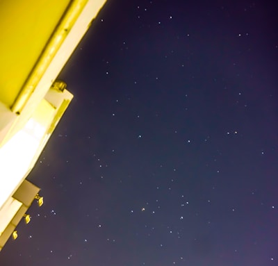 Iconic landmark glowing under a clear night sky filled with stars