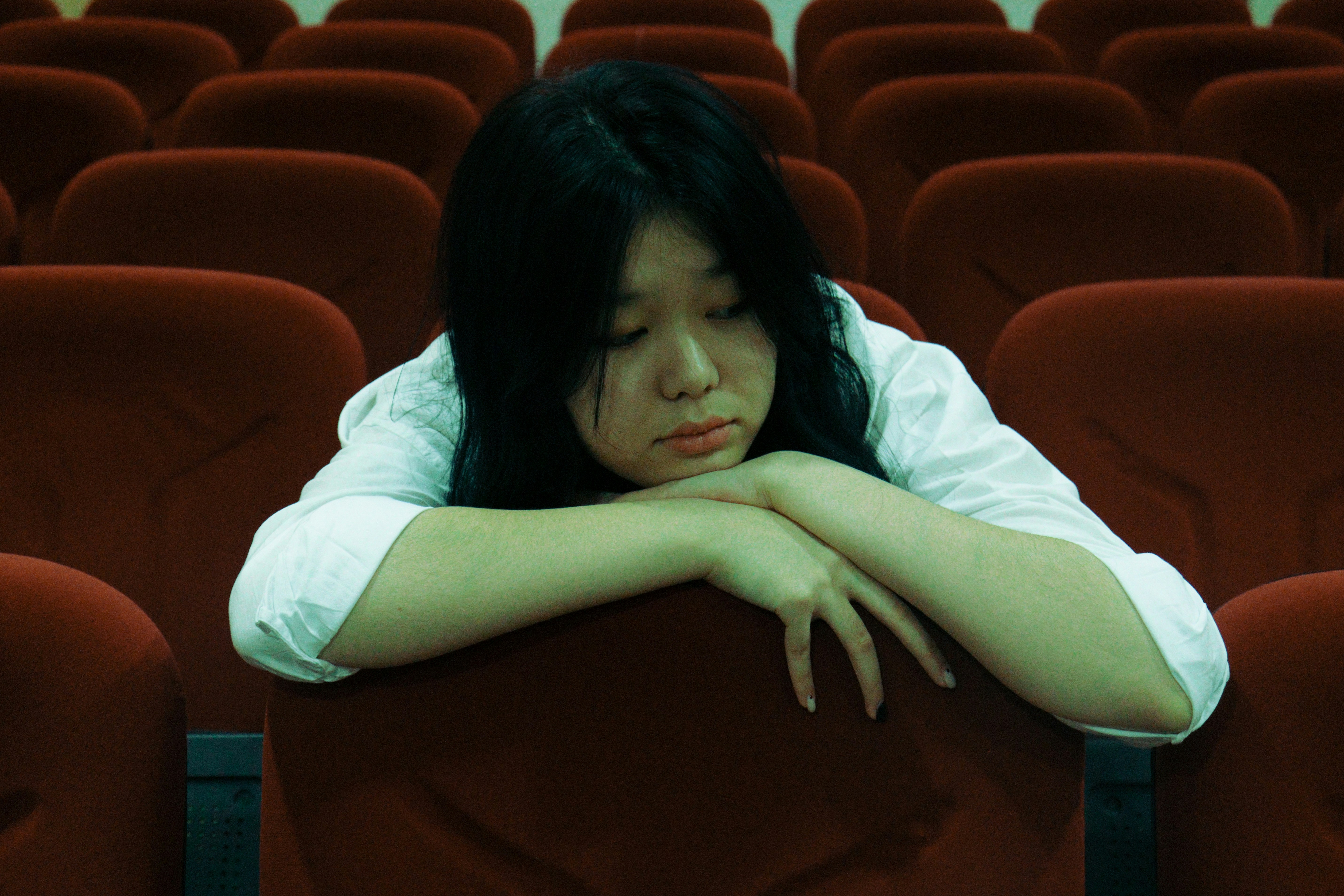 a person lying on a chair