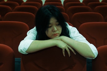 a person lying on a chair