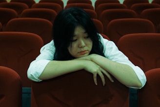 a person lying on a chair