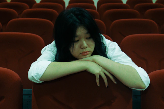a person lying on a chair