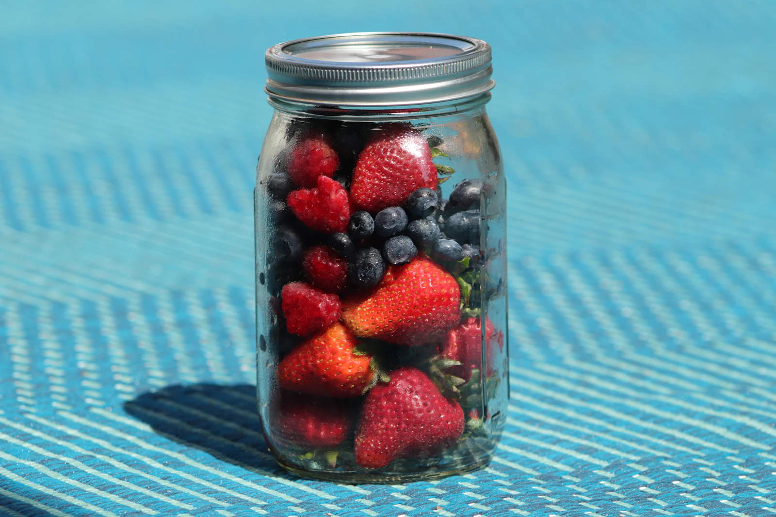 A jar filled with berries