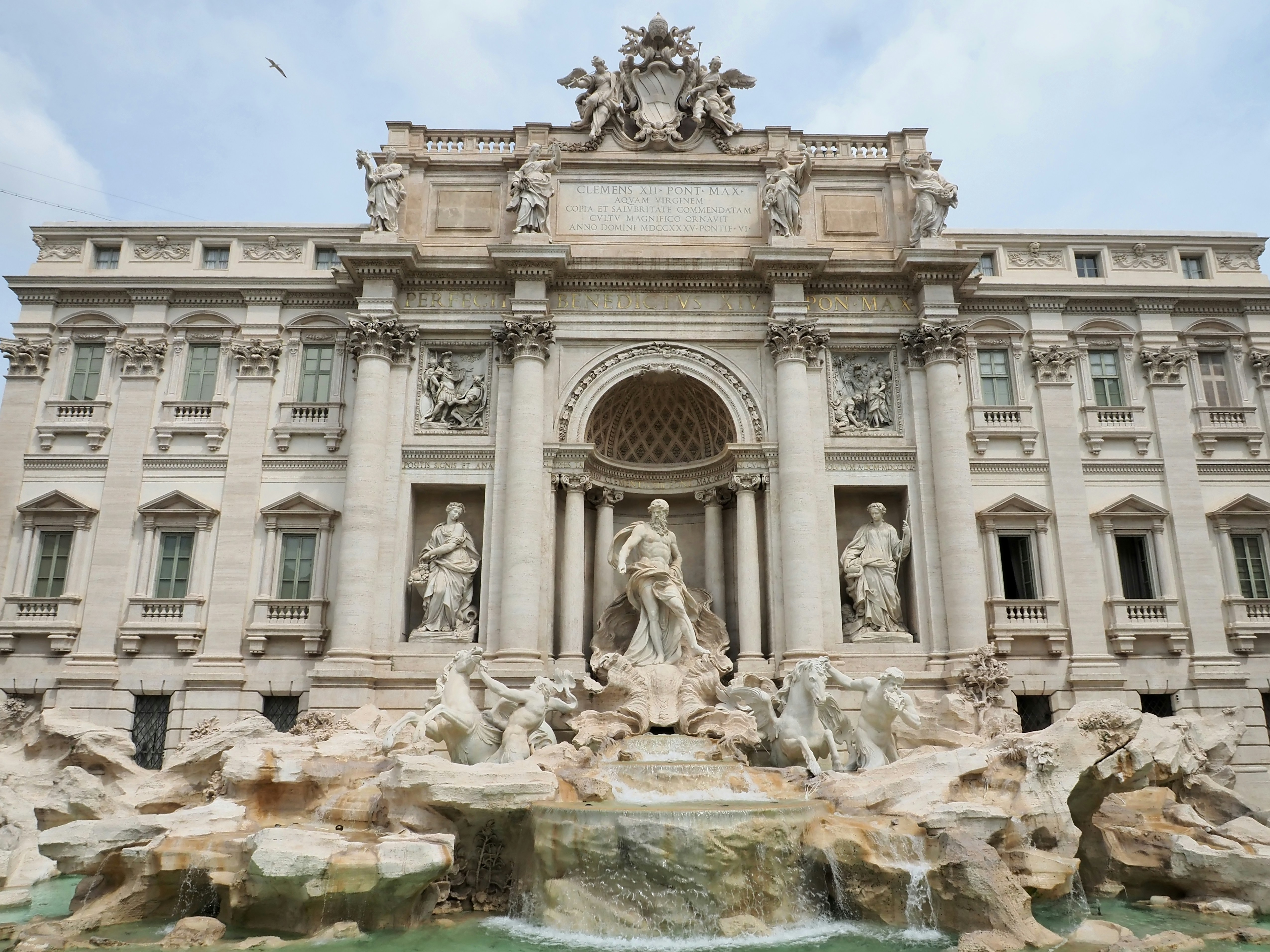 a large building with statues and a fountain in front of it with Trevi Fountain in the background, Trevi fountain in the morning, Rome, Italy. Rome baroque architecture and landmark. 