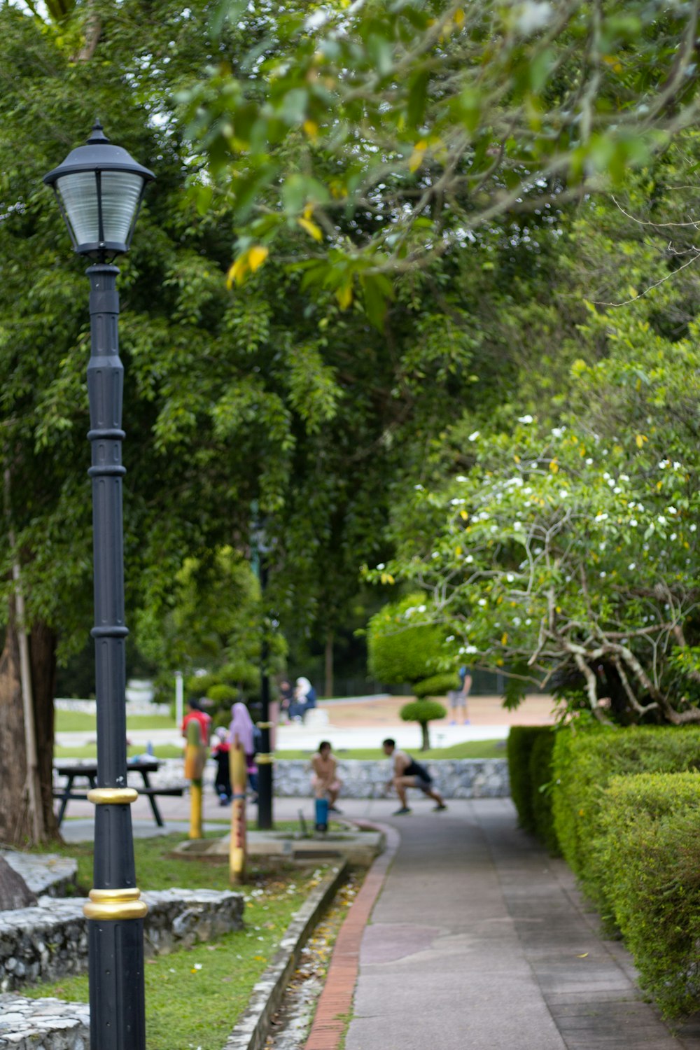 a lamp post on a sidewalk