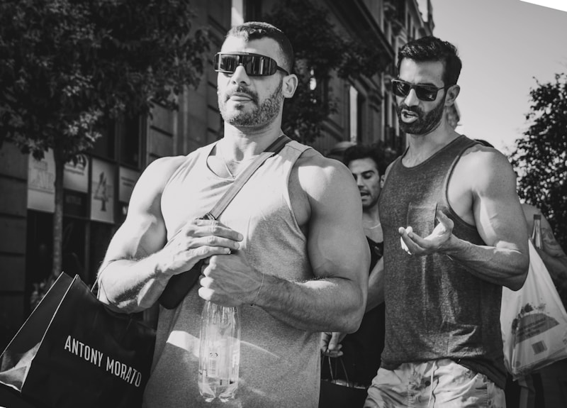 Stylish gay couple in sunglasses