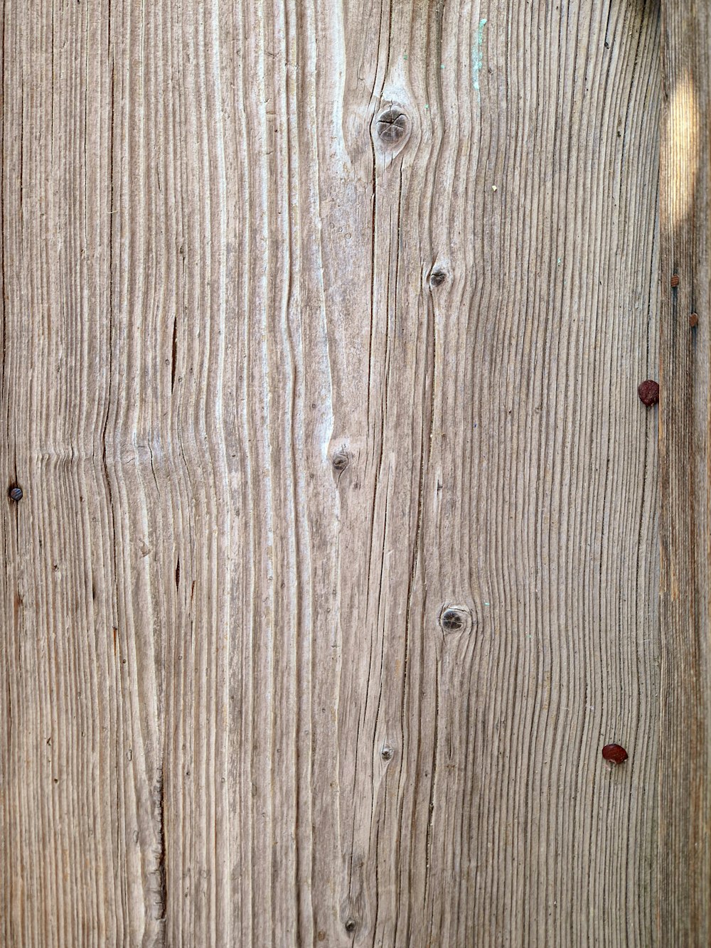 a wood surface with holes