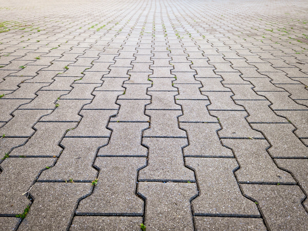 A clean paver block driveway pattern after restoration