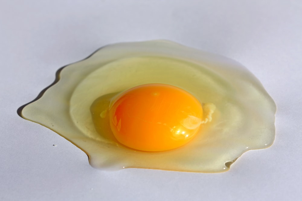 a yellow egg in a white bowl